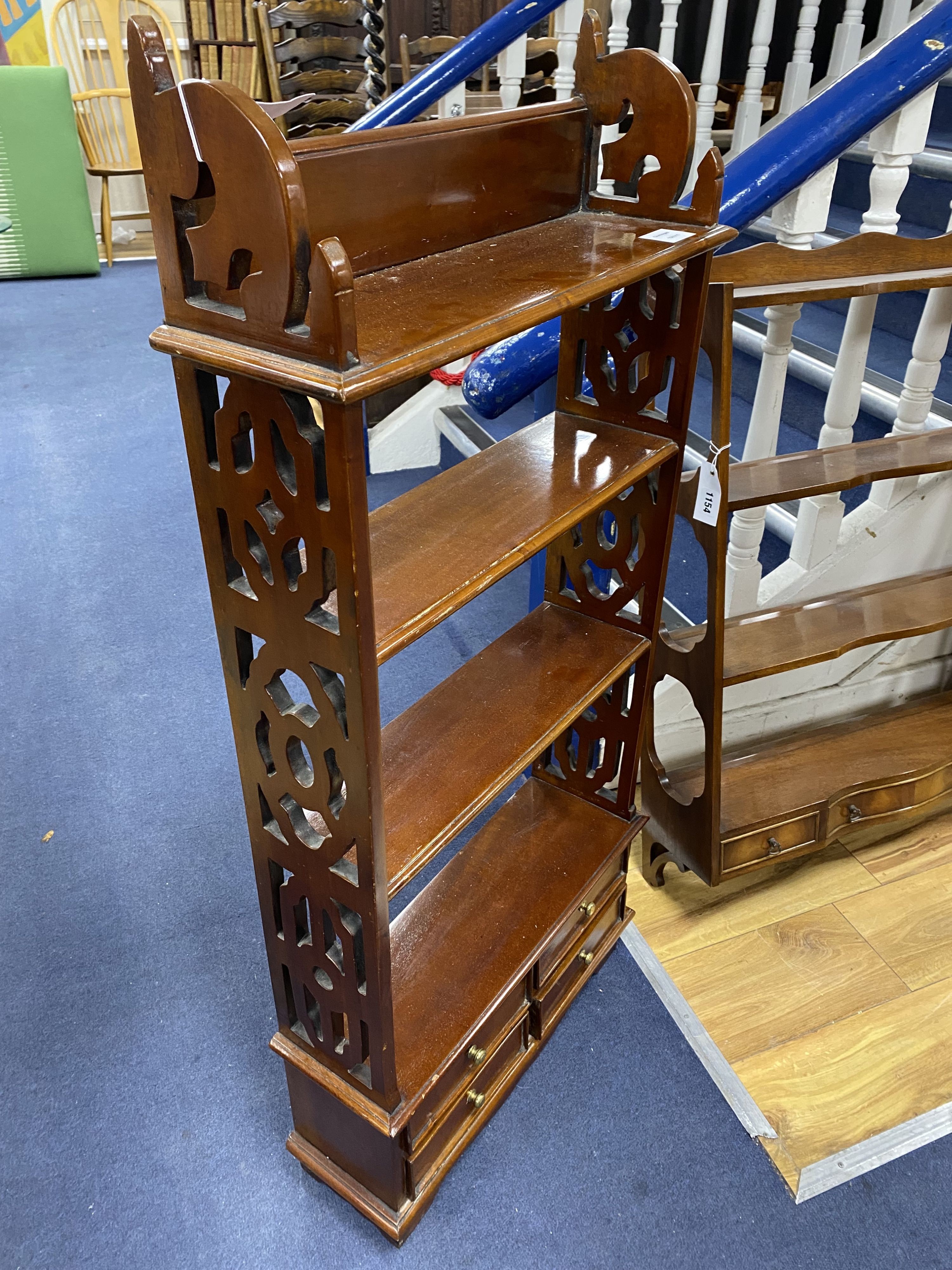 Two mahogany wall brackets, larger width 69cm, height 93cm